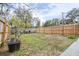 Fenced backyard, perfect for gardening, with a grill and lawn space at 14430 10Th. St, Dade City, FL 33523