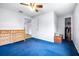 Bright bedroom featuring blue carpet and built-in dresser at 14430 10Th. St, Dade City, FL 33523