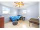 Bedroom with twin bed, nightstand, and ceiling fan at 14430 10Th. St, Dade City, FL 33523