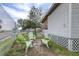 Relaxing patio area with green chairs around a fire pit at 14430 10Th. St, Dade City, FL 33523