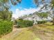 House exterior with well-maintained landscaping at 1530 Rebecca Ln # 401, Dunedin, FL 34698