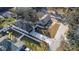 Property overview showing house, driveway, and surrounding neighborhood at 1696 Wilmar Ave, Tarpon Springs, FL 34689
