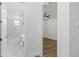 Clean bathroom with white marble-look tile and a bathtub at 1696 Wilmar Ave, Tarpon Springs, FL 34689