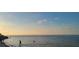 Scenic beach view with calm water and sunset sky at 1696 Wilmar Ave, Tarpon Springs, FL 34689