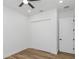 Spacious bedroom with wood-look floors and built-in closet at 1696 Wilmar Ave, Tarpon Springs, FL 34689