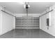 Spacious garage with automatic door opener and epoxy coated flooring at 1696 Wilmar Ave, Tarpon Springs, FL 34689