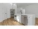 Modern kitchen with white cabinets and stainless steel appliances at 1696 Wilmar Ave, Tarpon Springs, FL 34689