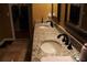 Bathroom with double vanity and granite countertop at 17346 Mint Leaf Ln, Land O Lakes, FL 34638