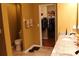 Bathroom featuring double sinks, granite counters and walk-in closet at 17346 Mint Leaf Ln, Land O Lakes, FL 34638