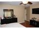 Spacious Primary bedroom with large mirror and TV at 17346 Mint Leaf Ln, Land O Lakes, FL 34638