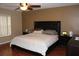 Large Primary bedroom with king-size bed and dark wood furniture at 17346 Mint Leaf Ln, Land O Lakes, FL 34638