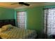 Bedroom with a full bed and teal colored walls at 17346 Mint Leaf Ln, Land O Lakes, FL 34638