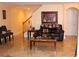 Living room with a cozy leather couch and a staircase at 17346 Mint Leaf Ln, Land O Lakes, FL 34638
