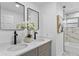 Updated bathroom with double vanity, modern fixtures, and marble shower at 1758 Winfield Cir, Clearwater, FL 33756