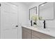 Modern bathroom with double vanity, updated fixtures, and stylish mirrors at 1758 Winfield Cir, Clearwater, FL 33756