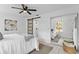 Bedroom with a queen bed, mirrored closet, and barn door to the bathroom at 1758 Winfield Cir, Clearwater, FL 33756