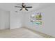 Bedroom with pool view and wood-look flooring at 1758 Winfield Cir, Clearwater, FL 33756