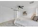 Spacious bedroom with a queen bed and barn door at 1758 Winfield Cir, Clearwater, FL 33756