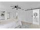 Bright bedroom with a queen bed and a view of the bathroom at 1758 Winfield Cir, Clearwater, FL 33756