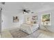 Bedroom with a queen bed, ceiling fan, and two windows at 1758 Winfield Cir, Clearwater, FL 33756