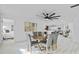 Open concept dining area with wood table and grey chairs at 1758 Winfield Cir, Clearwater, FL 33756