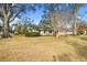 House with large front yard and mature trees at 1758 Winfield Cir, Clearwater, FL 33756