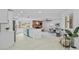 Modern kitchen featuring white cabinets and a teal island at 1758 Winfield Cir, Clearwater, FL 33756