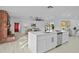Modern kitchen with white cabinets, quartz countertops, and island at 1758 Winfield Cir, Clearwater, FL 33756