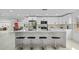 Modern kitchen with white cabinets, quartz countertops, and an island at 1758 Winfield Cir, Clearwater, FL 33756