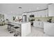 Modern kitchen with white cabinets and quartz countertops at 1758 Winfield Cir, Clearwater, FL 33756