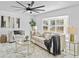 Bright living room features a comfy sofa, coffee table, and large windows at 1758 Winfield Cir, Clearwater, FL 33756