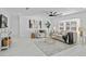 Living room with comfy seating and large windows at 1758 Winfield Cir, Clearwater, FL 33756