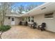 Relaxing patio area with seating and view of the pool at 1758 Winfield Cir, Clearwater, FL 33756