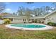 Large kidney shaped pool with brick coping at 1758 Winfield Cir, Clearwater, FL 33756