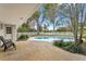 Relaxing pool area with patio and lush landscaping at 1758 Winfield Cir, Clearwater, FL 33756