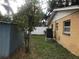 Backyard with AC unit and small tree at 1766 Montana Ne Ave, St Petersburg, FL 33703