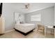 Simple bedroom with a bed, desk, and chair at 1766 Montana Ne Ave, St Petersburg, FL 33703
