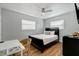 Guest bedroom with a queen-size bed and a small workspace at 1766 Montana Ne Ave, St Petersburg, FL 33703