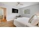 Main bedroom with king bed, TV, and workspace at 1766 Montana Ne Ave, St Petersburg, FL 33703