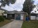 Single story home with stone exterior and a spacious driveway at 1766 Montana Ne Ave, St Petersburg, FL 33703
