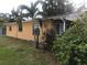Tan house exterior with landscaping at 1766 Montana Ne Ave, St Petersburg, FL 33703