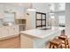 Modern kitchen with white cabinets, stainless steel appliances and quartz countertops at 1766 Montana Ne Ave, St Petersburg, FL 33703