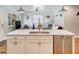 Modern kitchen with white cabinets, island, and stainless steel appliances at 1766 Montana Ne Ave, St Petersburg, FL 33703