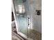 Shower with glass enclosure and pebble floor at 1766 Montana Ne Ave, St Petersburg, FL 33703
