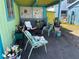 Relaxing patio area with covered seating and potted plants at 18006 4Th E St, Redington Shores, FL 33708