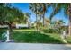 Landscaped community lawn with hose stations at 1801 East Lake Rd # 1G, Palm Harbor, FL 34685