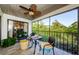 Relaxing screened balcony with outdoor seating and lush views at 1801 East Lake Rd # 1G, Palm Harbor, FL 34685