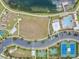 Community features include pool, tennis courts, playground, and lake access at 18811 Deer Tracks Loop, Lutz, FL 33558