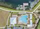 Resort-style pool, expansive sundeck, and serene lake views at 18811 Deer Tracks Loop, Lutz, FL 33558