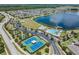 Community boasts tennis courts, pool, playground, and lake access at 18811 Deer Tracks Loop, Lutz, FL 33558